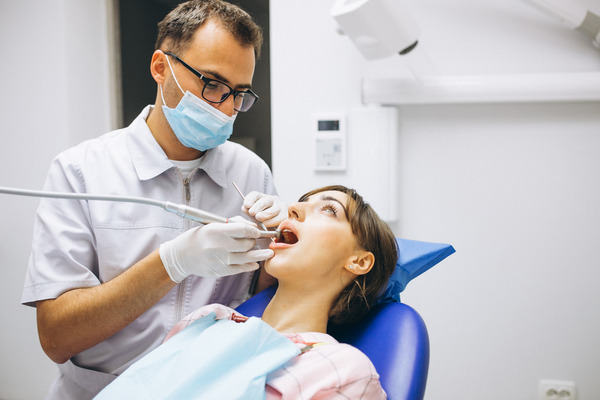 Root canal specialist performing dental procedure on a patient