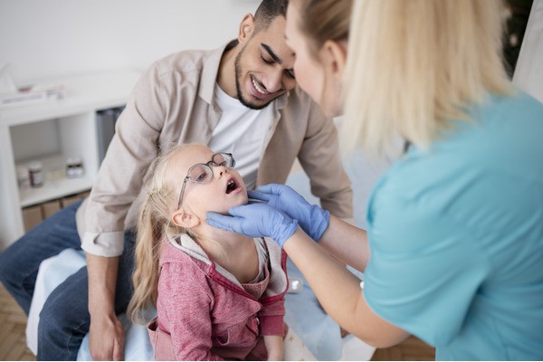 Child getting teeth examined at the dentist