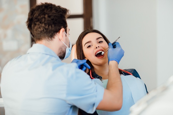 Woman receiving dental treatment for oral health in Canada
